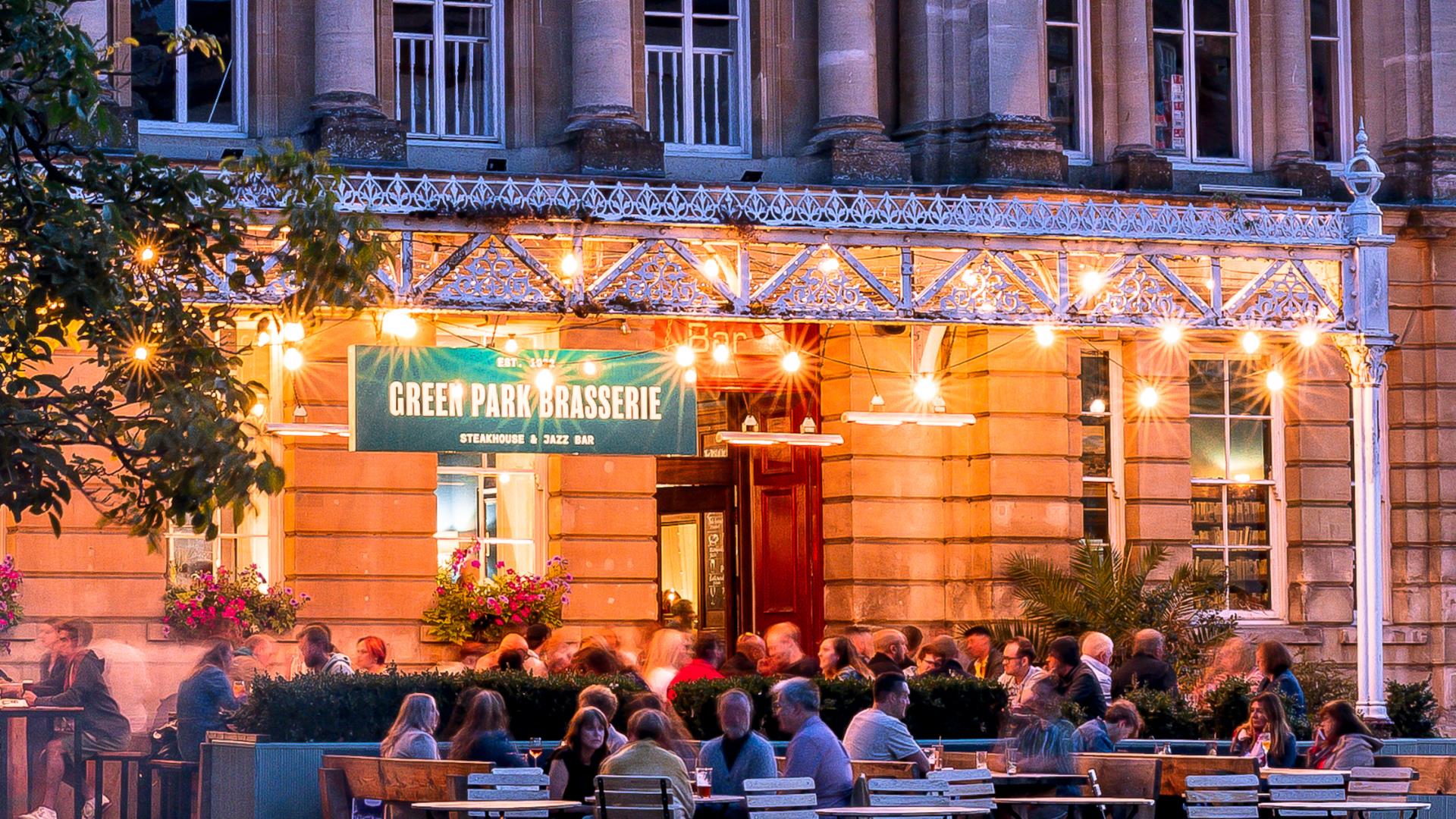 Green Park Brasserie front terrace lit up with sign
