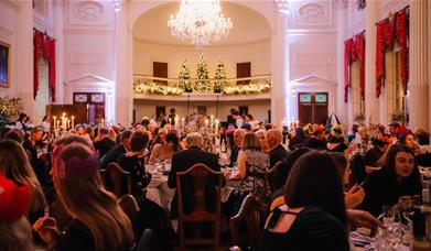 Guests sit for a black tie banquet in the Pump Room