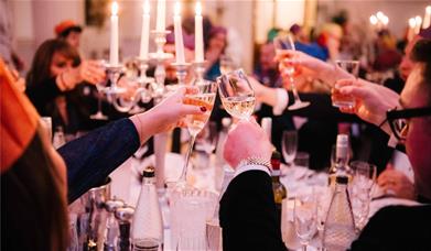 Party-goers cheers in the Pump Room at Christmas
