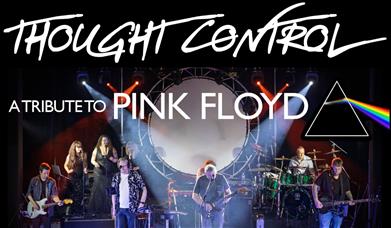 Live stage photo of Thought Control, a Pink Floyd tribute band, performing under dramatic lighting with a circular screen and prism imagery behind the
