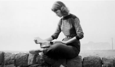 seated woman reading