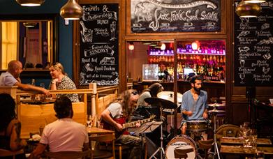 A band performing in a restaurant