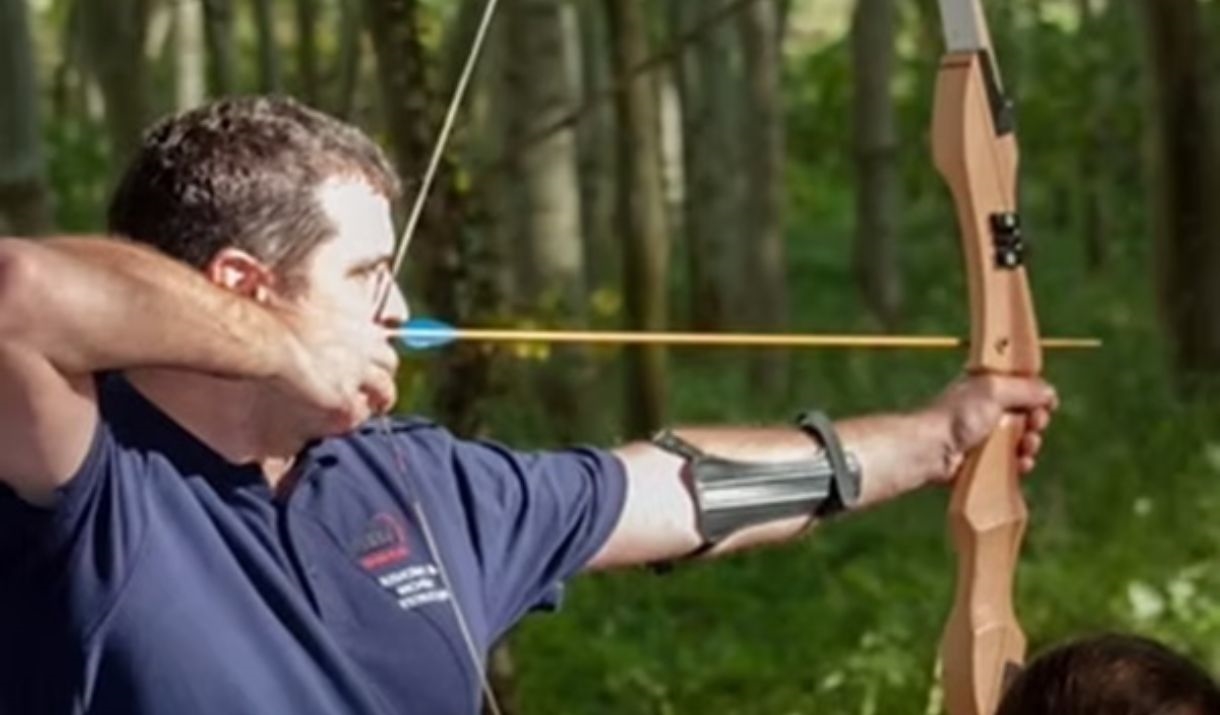A man holding a bow and arrow