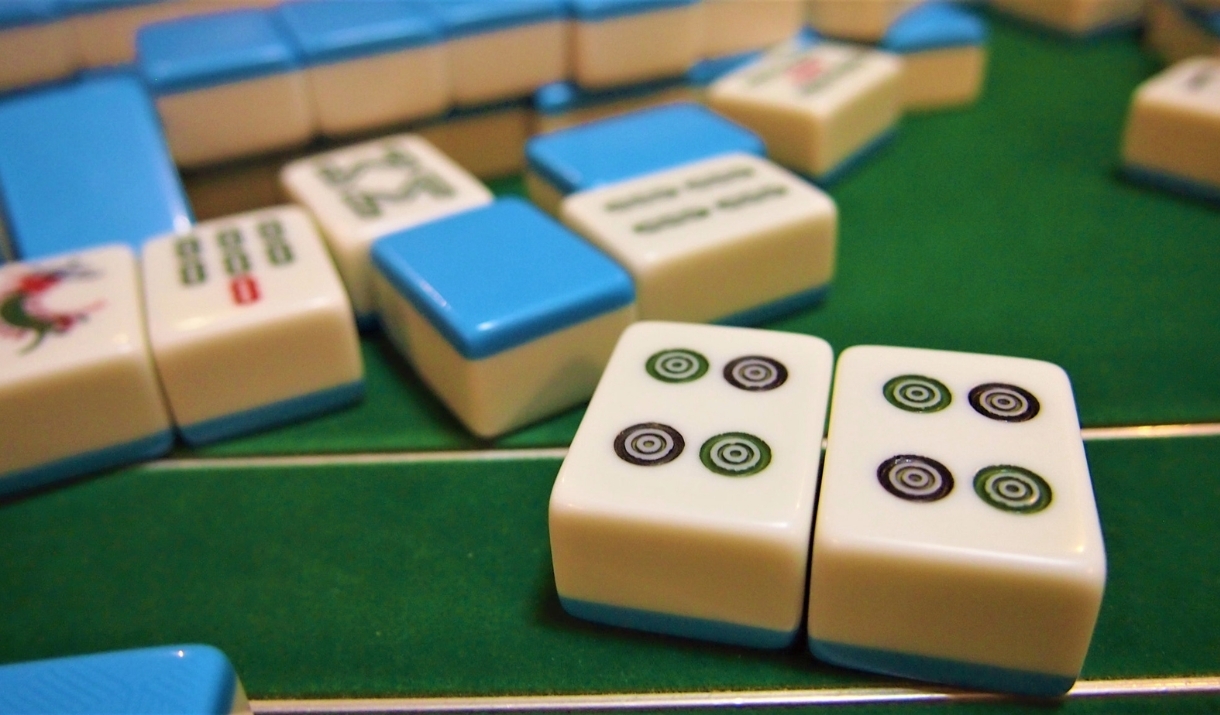 Mahjong tiles on green board