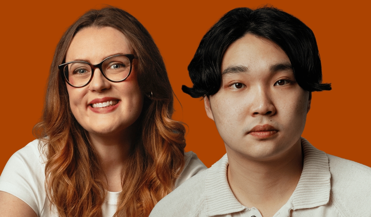 Two people against an orange background - one smiling and wearing glasses, one with a neutral expression.