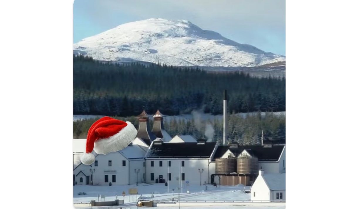 a snow scene of dalwhinnie distillery with a santa hat on it