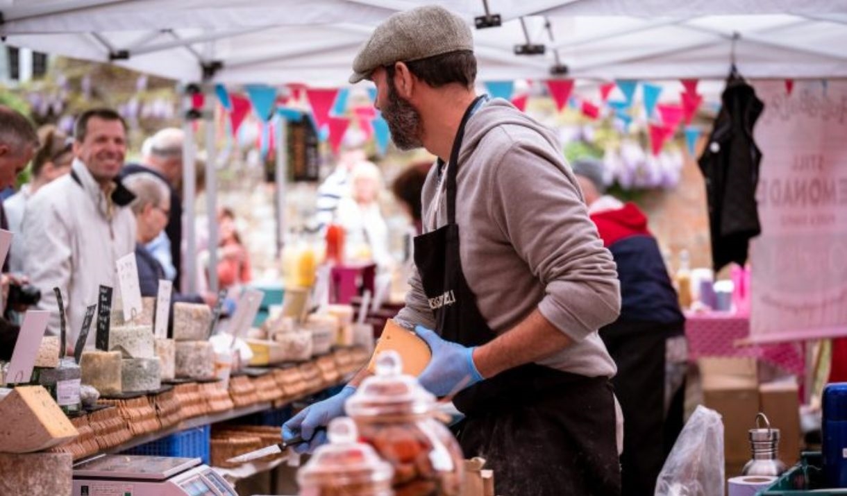 photo taken through a chees stall looking out at the food festival