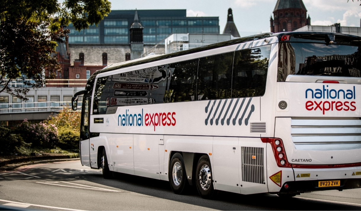 Bus parked and with a city backdrop