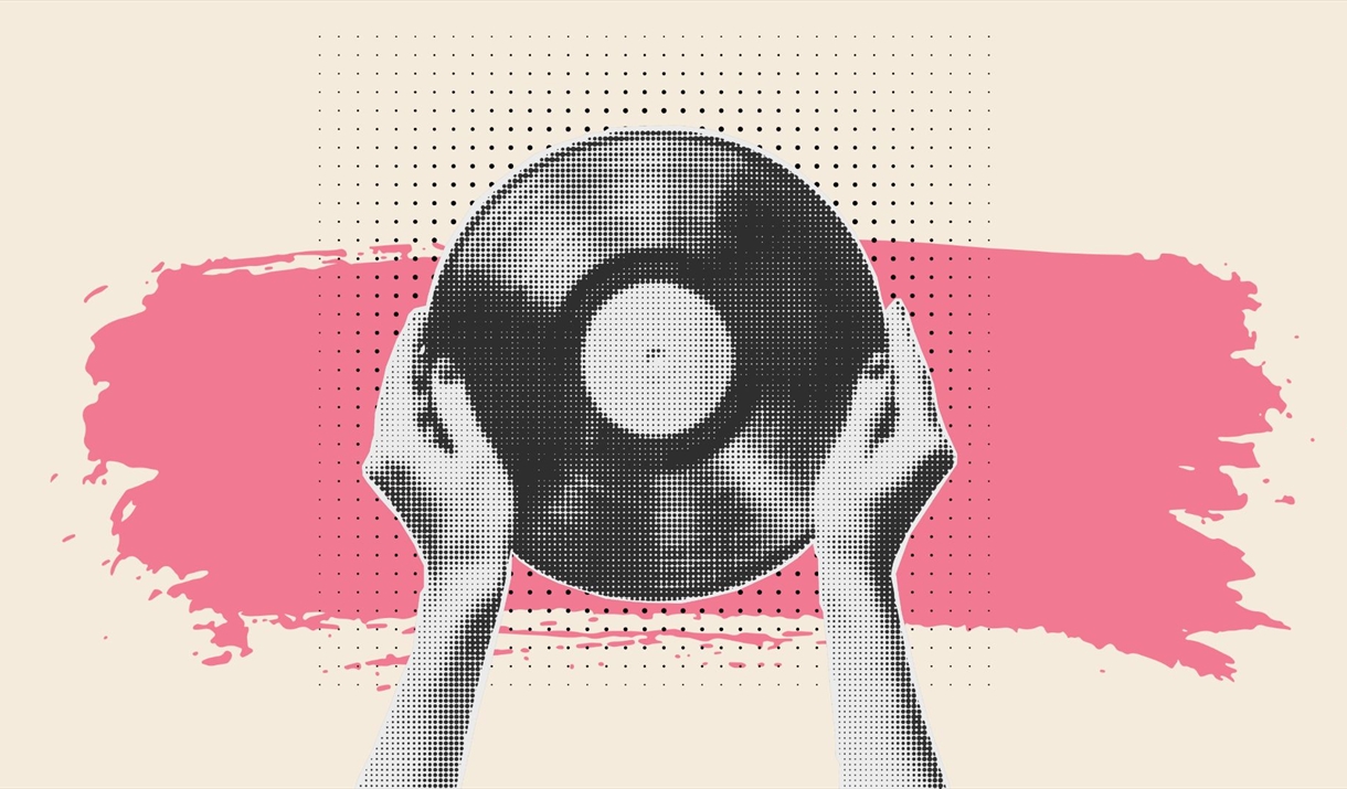 Image of hands holding up a record