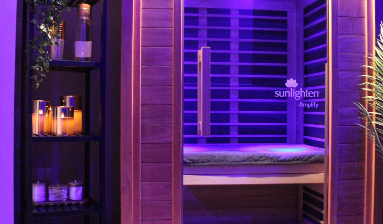 Infrared treatment room at Relax Recover, with a shelf to the left-hand side containing several candles.