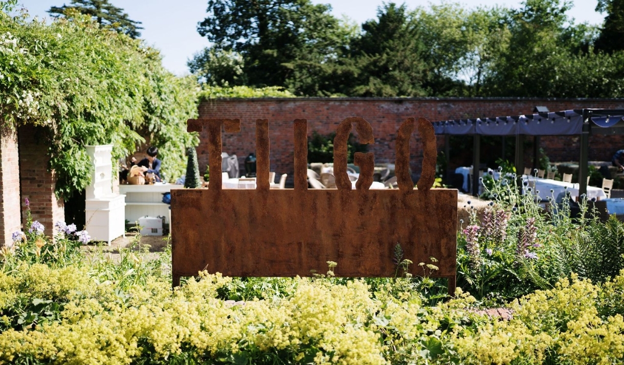 The exterior sign of the TIIGO restaurant at Montigo Resorts Somerset in Shepton Mallet.