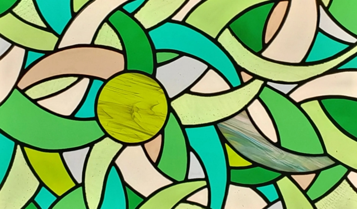 abstract stained glass artwork in greens