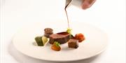 Gravy pouring on food
