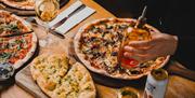 Pizzas and garlic bread