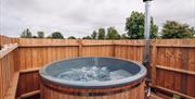 Circular hot tub with wooden sides