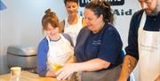 A group of people attending a cooking class.