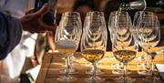 A table of glasses full of wine.