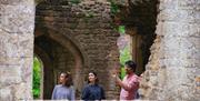 Jules presenting to a group in ruins