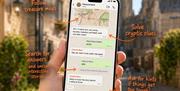 A phone displaying a series of clues and a map on a Whatsapp screen.