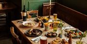 Table set with food and pints