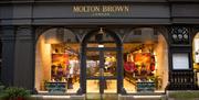 The exterior of Molton Brown in Bath, with large windows and step-free access.