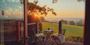 View of the porch overlooking the field at sundown