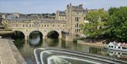An image of Pulteney Bridge in Bath during the day.