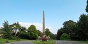 An image of the Victoria Column obelisk inside the Royal Victoria Park in Bath.