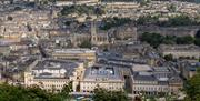 An aerial view of Bath city centre, showing SouthGate shopping centre and the Bath Abbey.