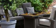 An alfresco seating area in the garden at the TIIGO restaurant within Montigo Resorts Somerset in Shepton Mallet.