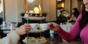 People cheersing tea