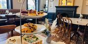 Interior of the Tea Bar and a table set up for afternoon tea
