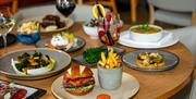 A table of food at The Orange Artichoke restaurant, based within the Apex City of Bath Hotel.