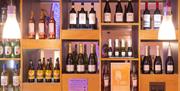 Wines on shelves in the bar at Wookey Hole Hotel
