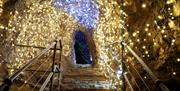 One of the caves at Wookey Hole covered in Christmas lights.