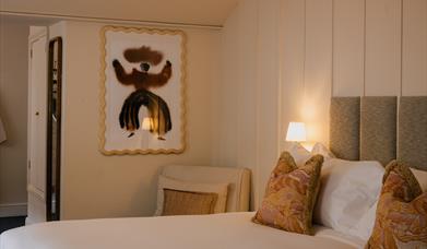 Hotel room with a picture on the wall